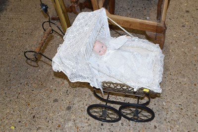 Lot 289 - A porcelain headed collectors doll in pram