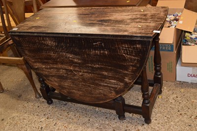 Lot 292 - A 20th Century oak drop leaf dining table