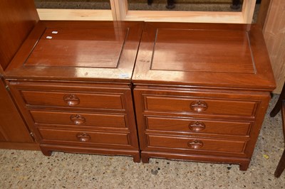 Lot 317 - Pair of Oriental hardwood three drawer bedside...