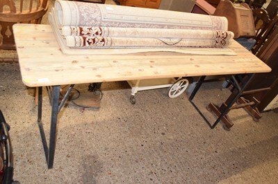 Lot 330 - A pine and metal framed trestle table