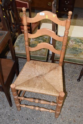 Lot 335 - A rush seated kitchen chair