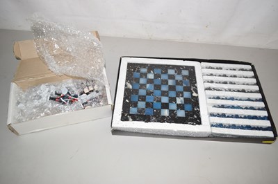 Lot 637 - A miniature chess board together with a set of...