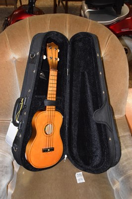 Lot 312 - A cased Chinese Lark ukelele