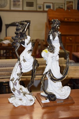 Lot 316 - Pair of bronzed resin figures