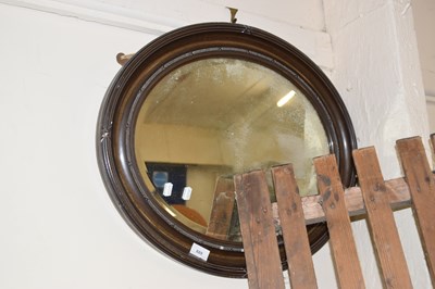 Lot 689 - An oval framed mirror