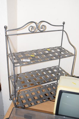 Lot 705 - A decorative metal table shelf