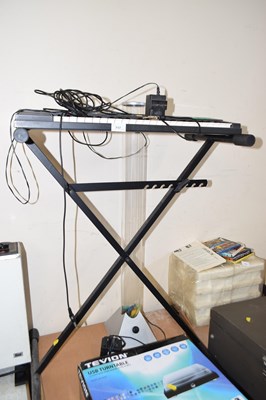 Lot 717 - A small Yamaha organ on stand together with a...