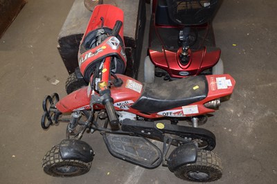 Lot 731 - A child's quad bike and helmet