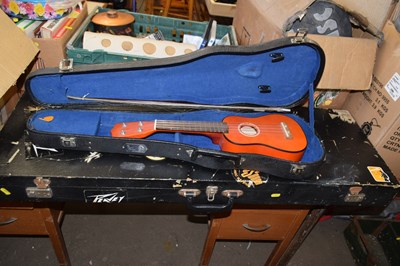 Lot 735 - A travelling guitar case together with a cased...