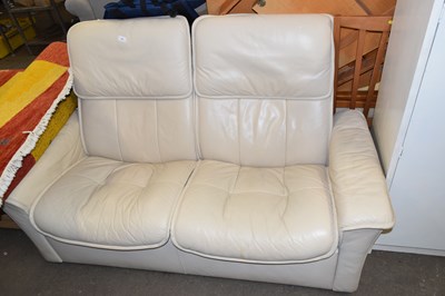 Lot 796 - A two seater cream leather sofa