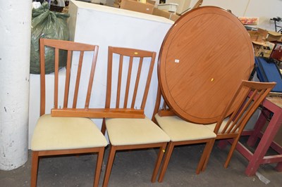 Lot 801 - A modern round dining table with four chairs