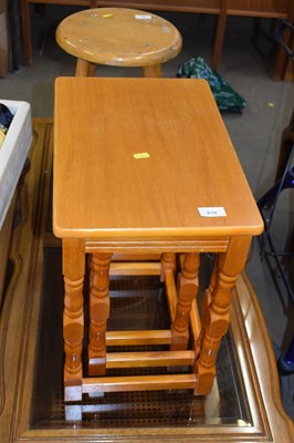 Lot 810 - A set of three nesting tables