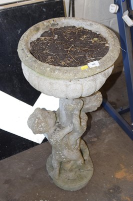 Lot 864 - A pedestal stone plant pot
