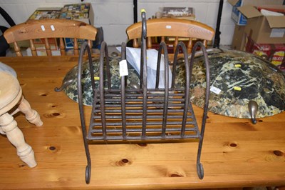 Lot 364A - An iron magazine rack