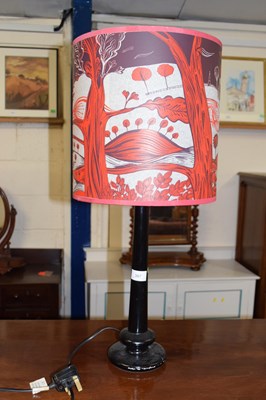 Lot 367 - A modern table lamp with red decorative shade