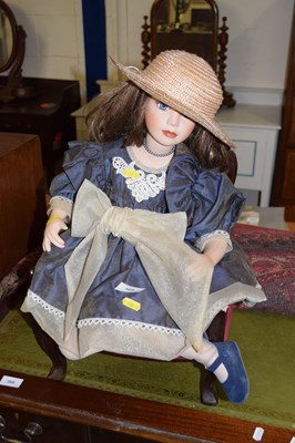Lot 369 - A collectors doll with chair