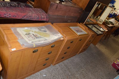 Lot 373 - A light wood effect three piece bedroom suite...