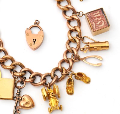 Lot 84 - A 9ct charm bracelet, the curblink bracelet...