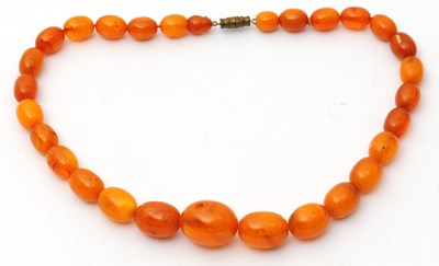 Lot 133 - A butterscotch amber bead necklace, with...