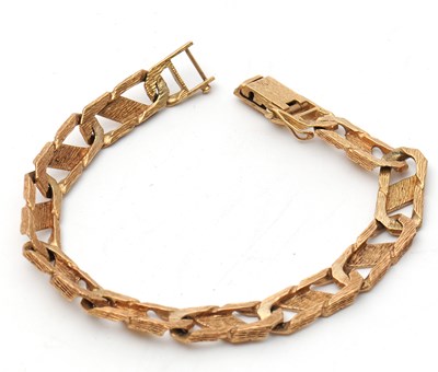 Lot 85 - A 9ct curblink bracelet, with smooth and...