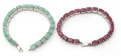 Lot 141 - Two gemset bracelets, one set with oval rubies...