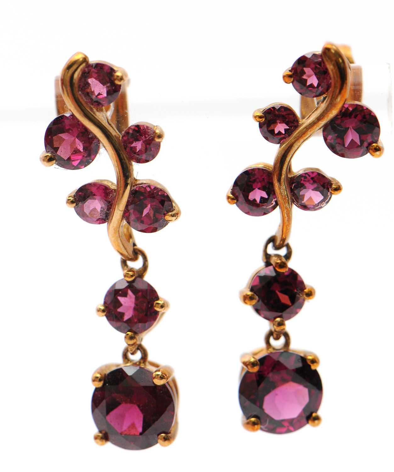 Lot 81 - A pair of 9ct garnet earrings, set with round...