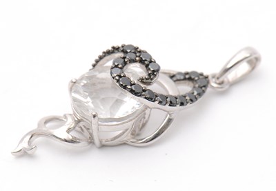 Lot 78 - Two 9ct pendants: to include a white stone and...