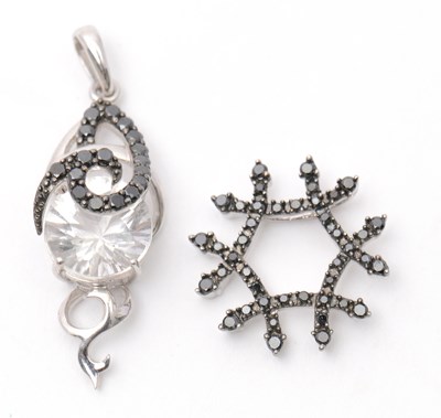 Lot 78 - Two 9ct pendants: to include a white stone and...