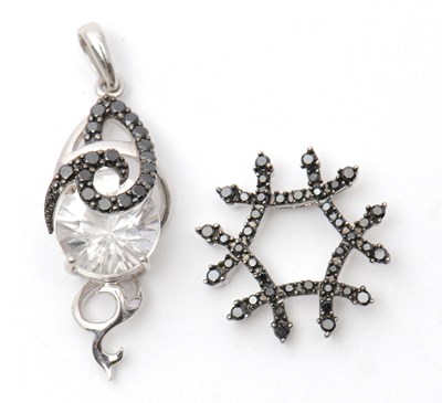 Lot 78 - Two 9ct pendants: to include a white stone and...