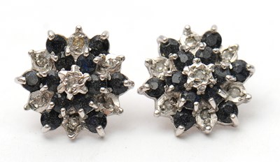 Lot 56 - A pair of 9ct sapphire and diamond earstuds,...