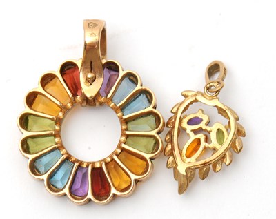 Lot 57 - Two gemset pendants: to include a 9ct multi...