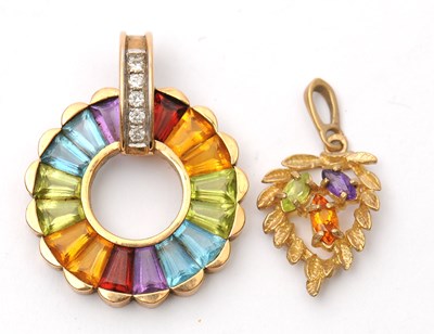 Lot 57 - Two gemset pendants: to include a 9ct multi...