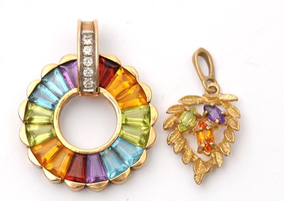 Lot 57 - Two gemset pendants: to include a 9ct multi...