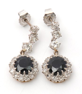 Lot 77 - A pair of synthetic sapphire and white stone...