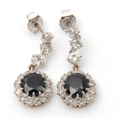 Lot 77 - A pair of synthetic sapphire and white stone...