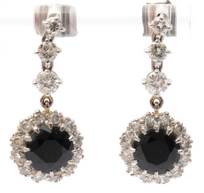 Lot 77 - A pair of synthetic sapphire and white stone...