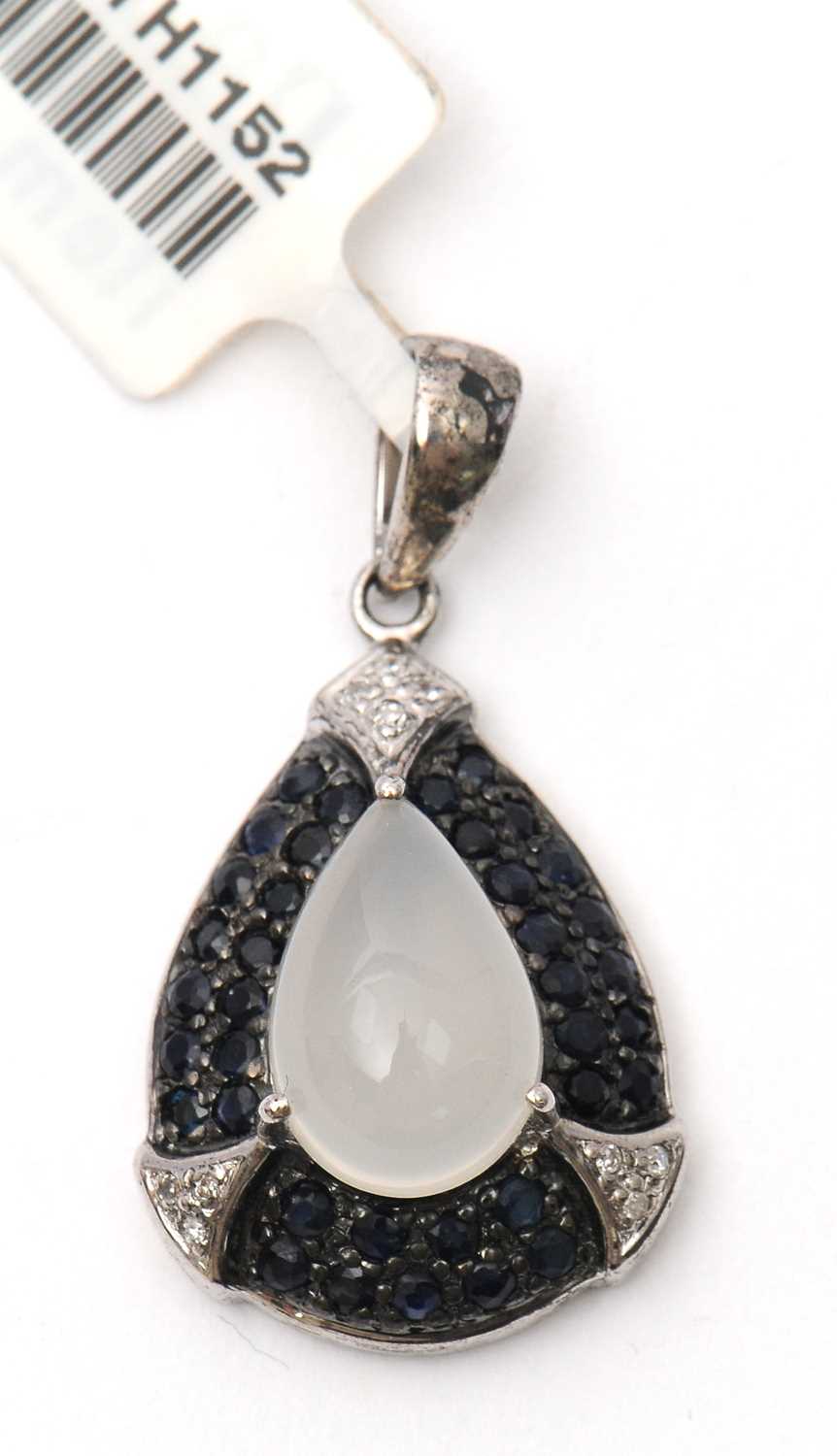 Lot 76 - A gemset pendant, the pear shape pendant with...