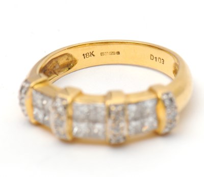 Lot 23 - An 18ct diamond ring, set with round brilliant...