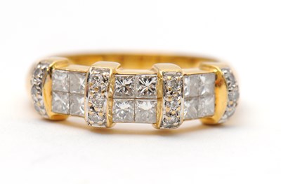 Lot 23 - An 18ct diamond ring, set with round brilliant...