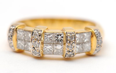Lot 23 - An 18ct diamond ring, set with round brilliant...