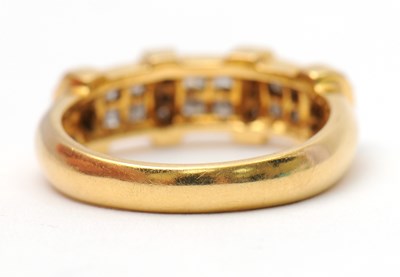 Lot 23 - An 18ct diamond ring, set with round brilliant...