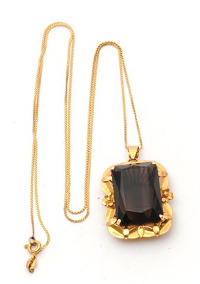 Lot 52 - A smokey quartz pendant and chain, the pendant...