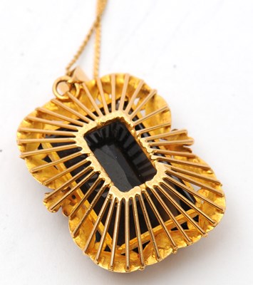 Lot 52 - A smokey quartz pendant and chain, the pendant...