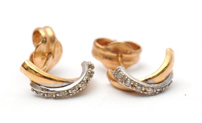 Lot 47 - A pair of unmarked bi-colour metal and white...
