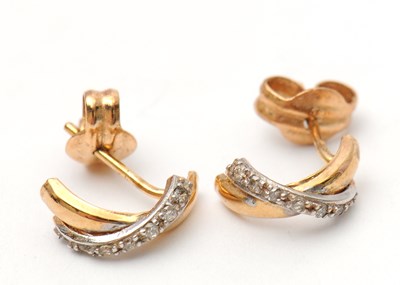 Lot 47 - A pair of unmarked bi-colour metal and white...