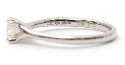 Lot 21 - A platinum diamond ring, with round brilliant...