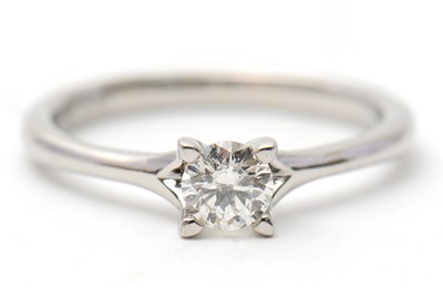 Lot 21 - A platinum diamond ring, with round brilliant...