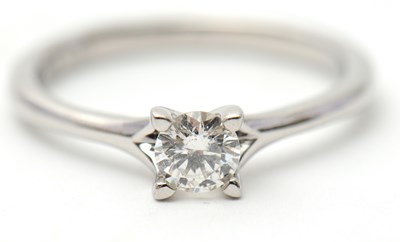 Lot 21 - A platinum diamond ring, with round brilliant...