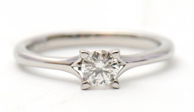 Lot 21 - A platinum diamond ring, with round brilliant...