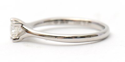 Lot 21 - A platinum diamond ring, with round brilliant...